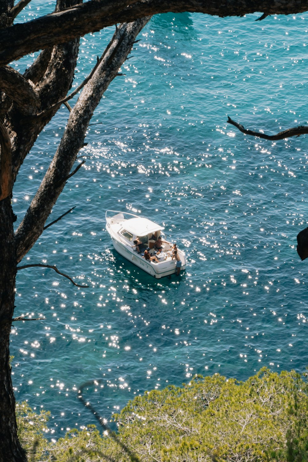 a small boat floating on top of a body of water