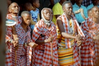 A group of colorful Maasai warriors in traditional attire.