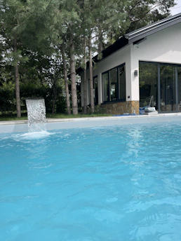 Pentair motor pump installed beside a sparkling clean pool