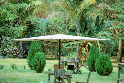 UV-resistant garden umbrella casting shade over a vibrant outdoor seating area.