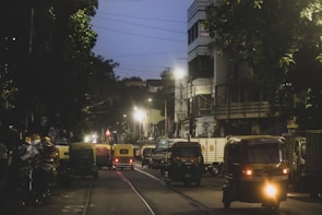 Maruti Dzire cruising through busy Delhi NCR streets with vibrant city lights