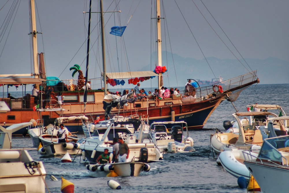 a group of boats floating on top of a body of water