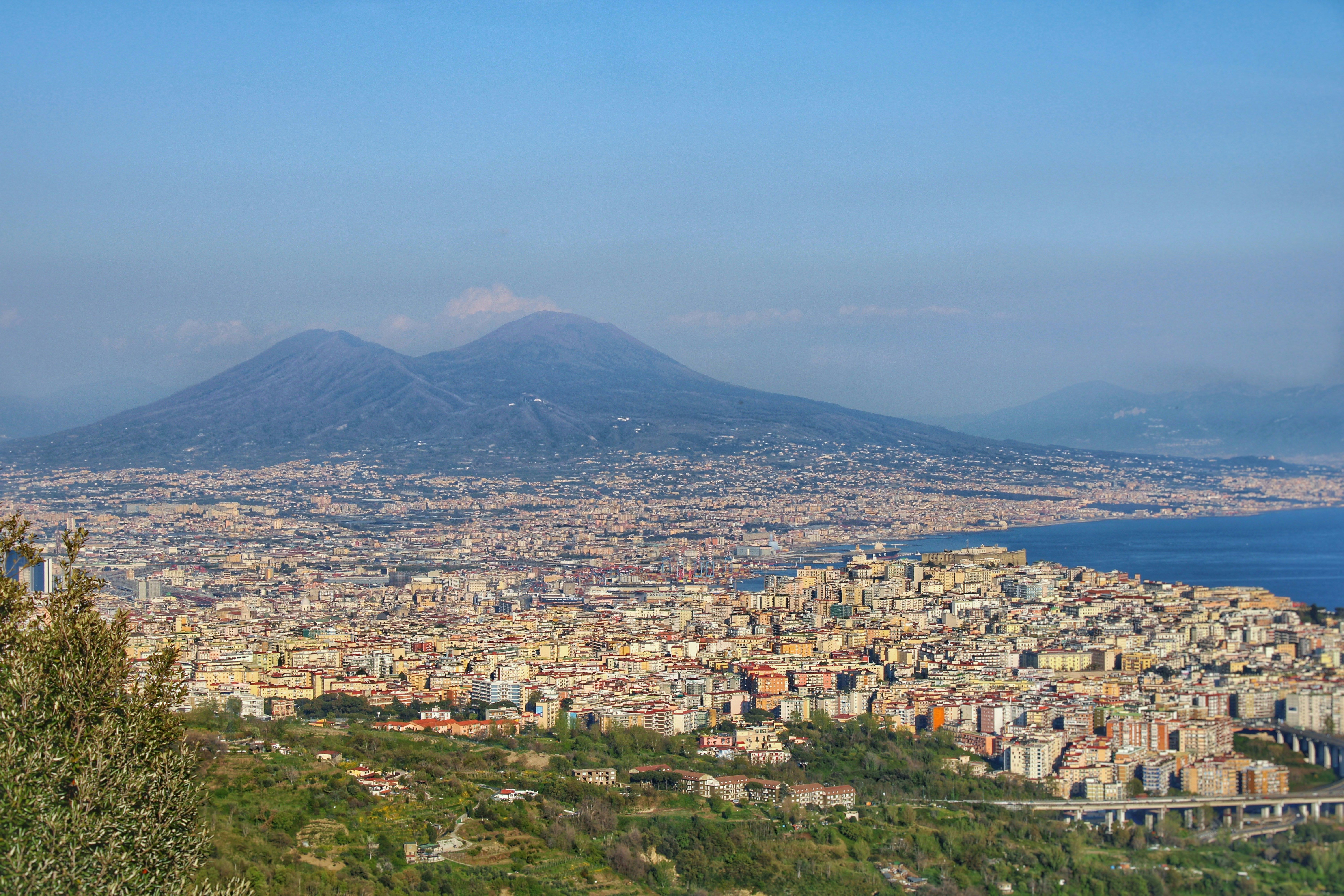 a view of a city with a mountain in the background