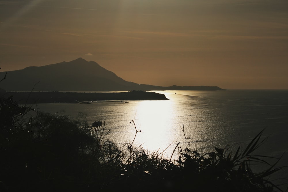 a view of a body of water with a mountain in the background