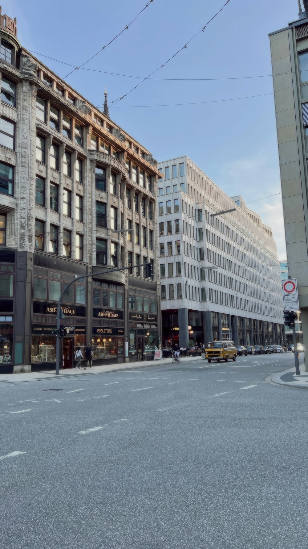 a city street with buildings and a traffic light