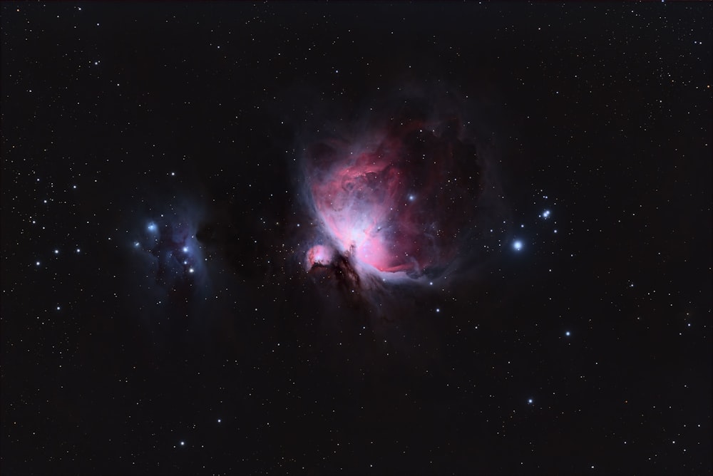 a large star cluster in the middle of a night sky