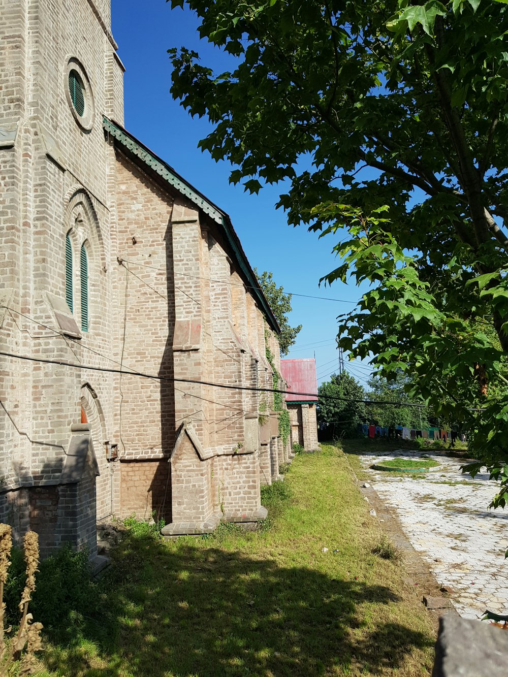 an old brick church with a clock tower