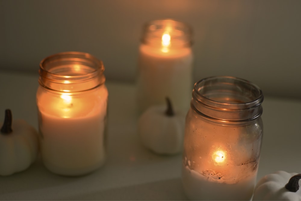 a group of candles sitting on top of a table