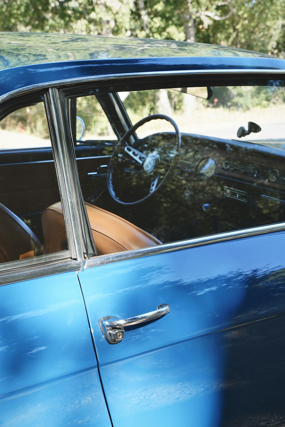 a blue car with a steering wheel and dashboard