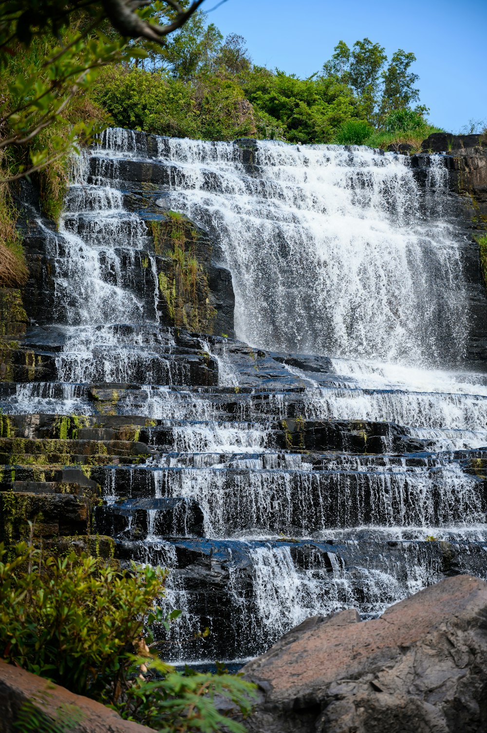 a large waterfall with lots of water coming out of it