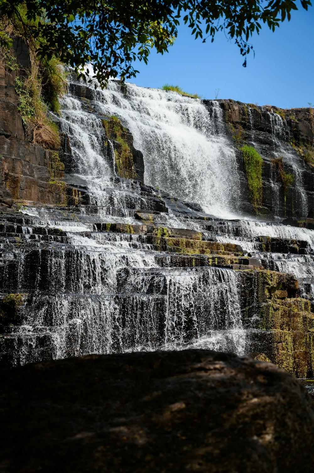 a large waterfall with lots of water coming out of it