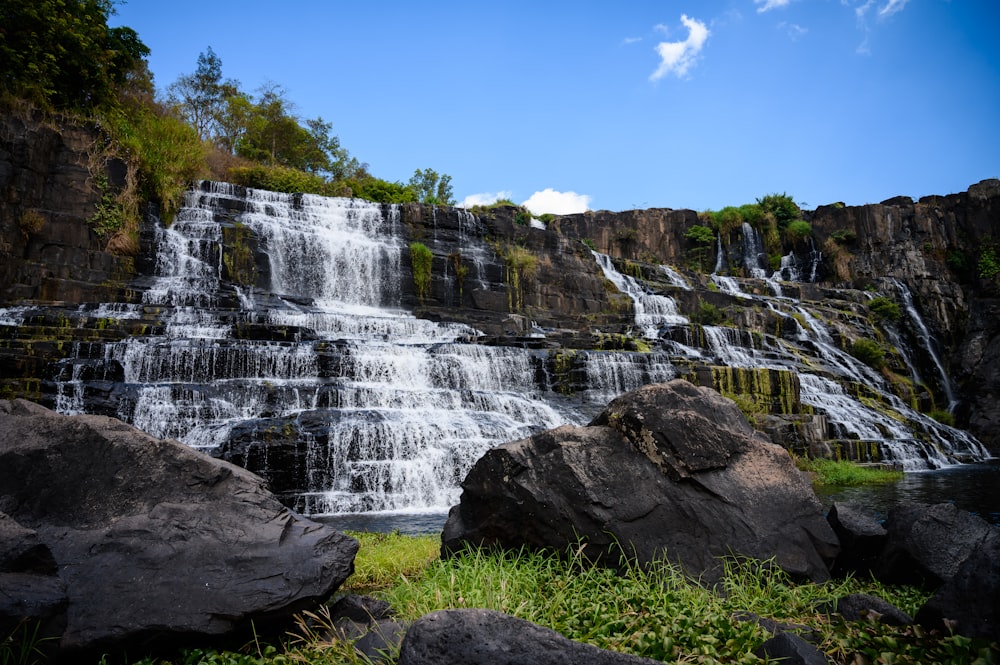 a large waterfall with lots of water coming out of it