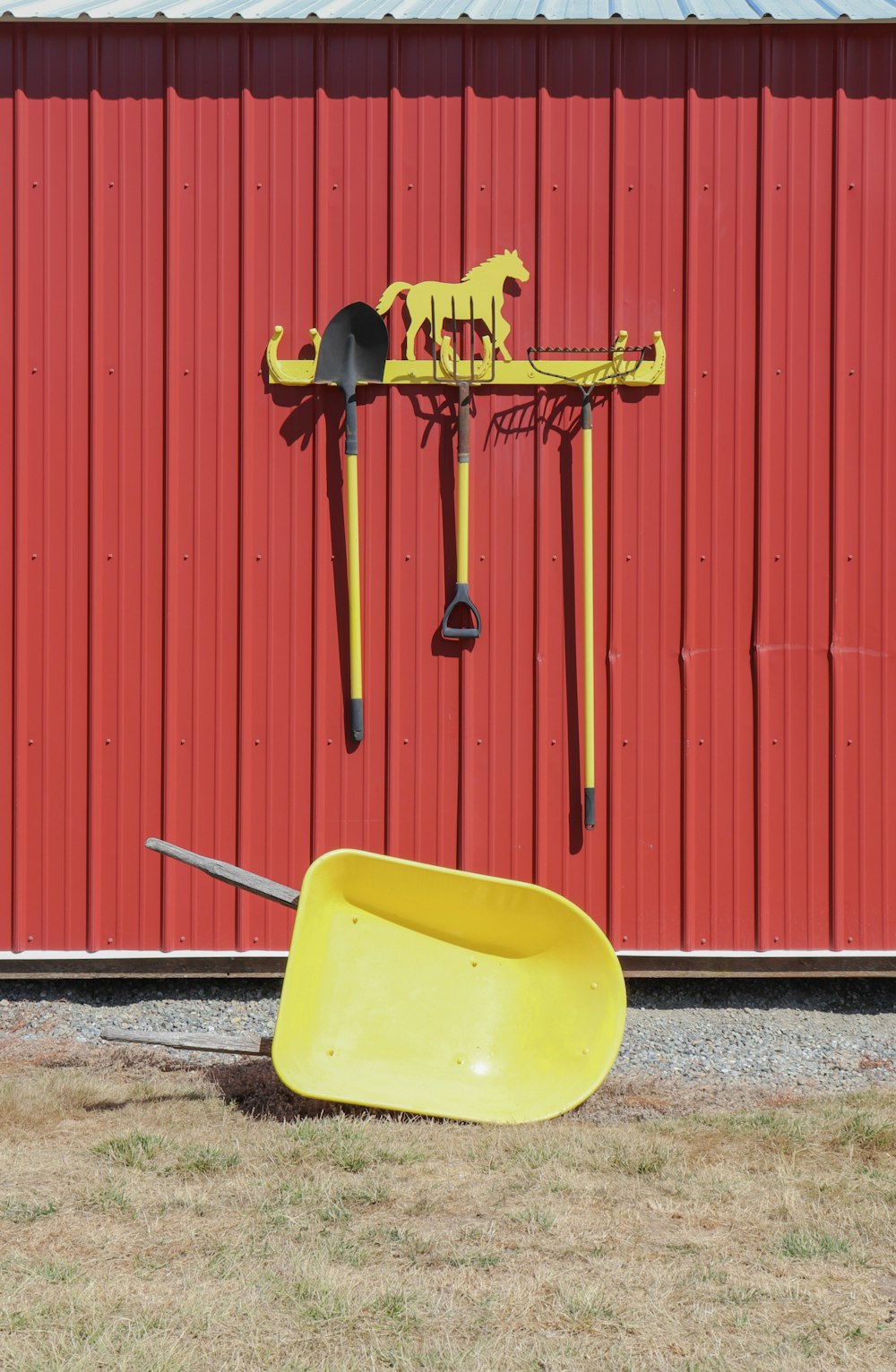 a yellow shovel and a yellow shovel on the ground