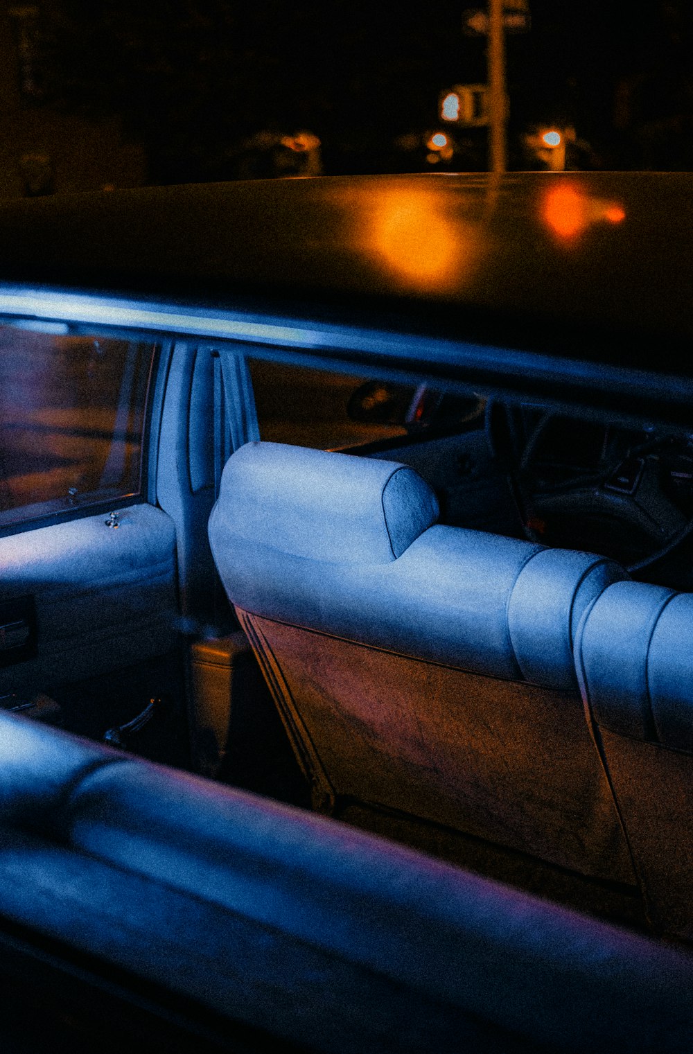 the interior of a car with blue leather seats