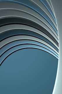 a blue and gray abstract background with curved lines