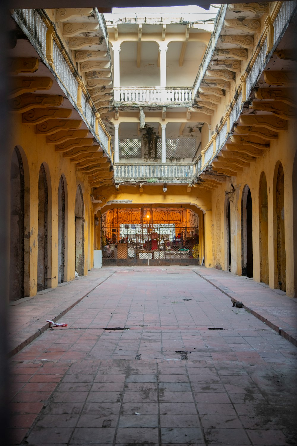 an empty building with a clock on the wall