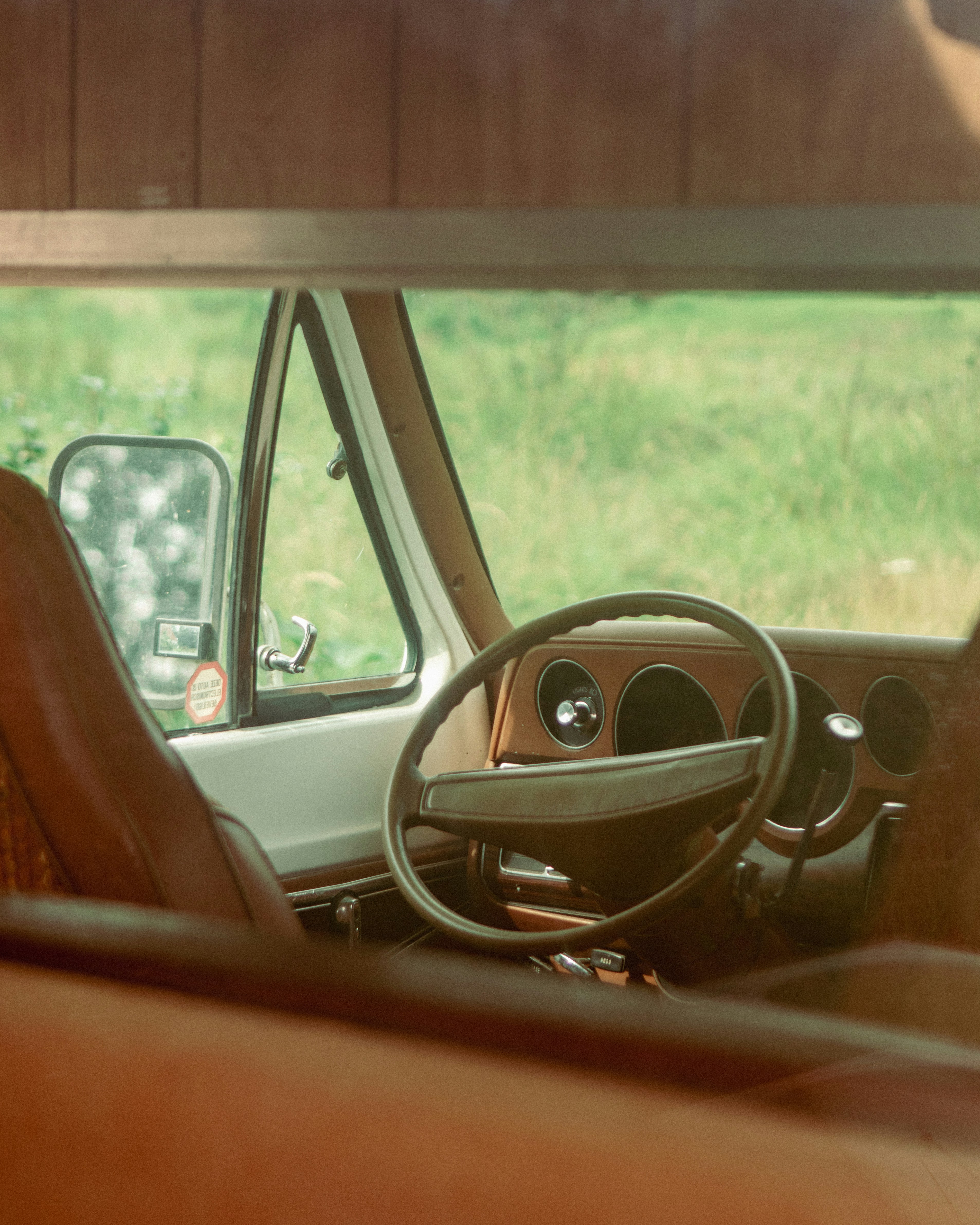 the interior of a car with a steering wheel and dashboard