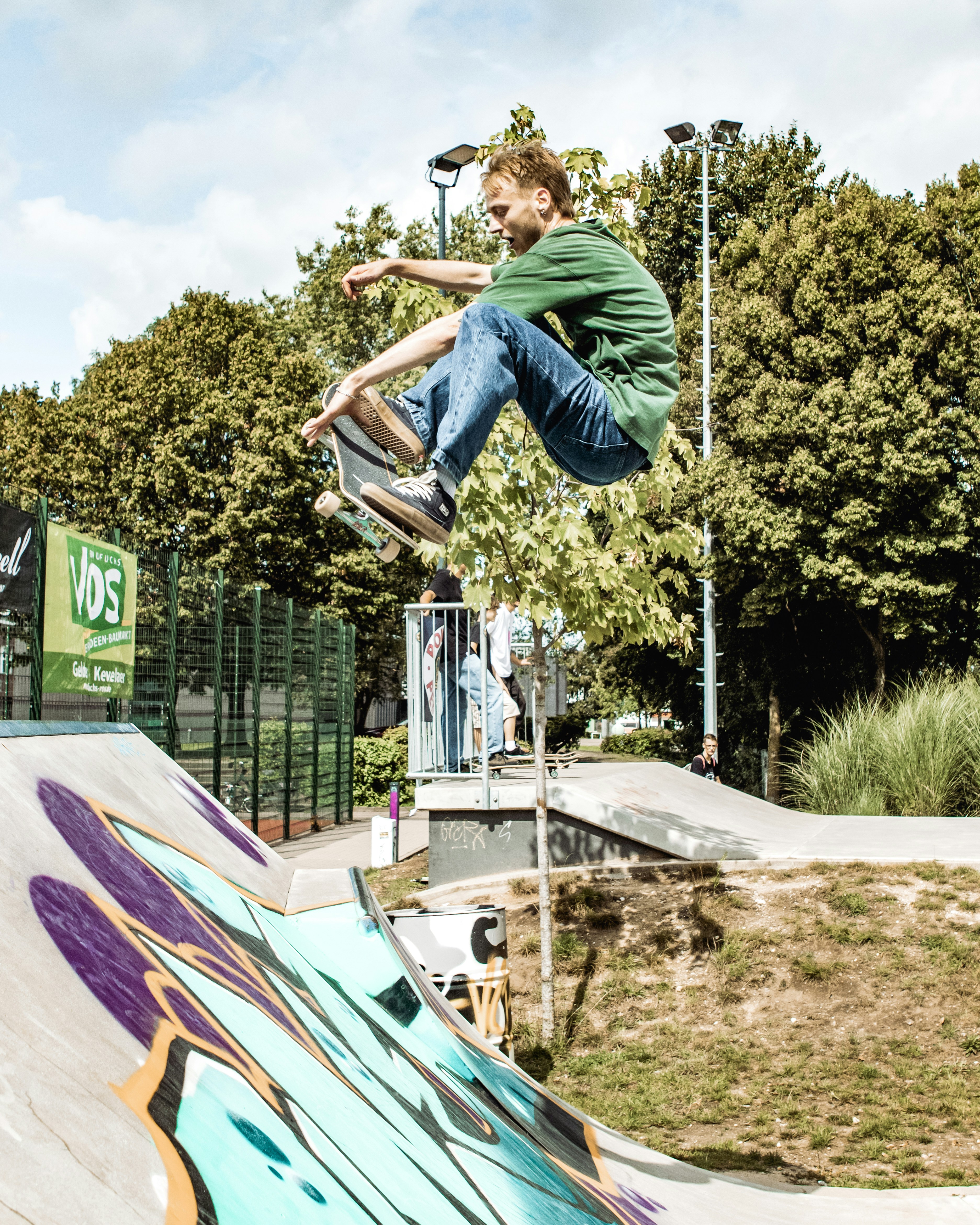 a man flying through the air while riding a skateboard