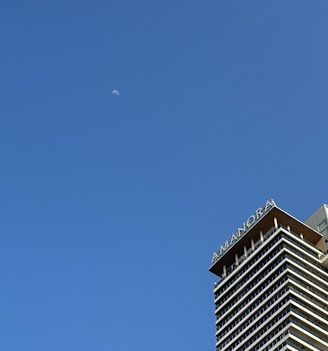 a very tall building with a sky background