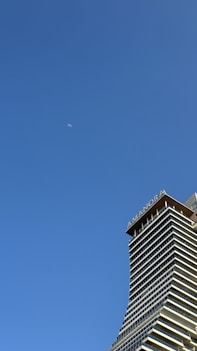 a very tall building with a sky background