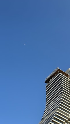 a very tall building with a sky background