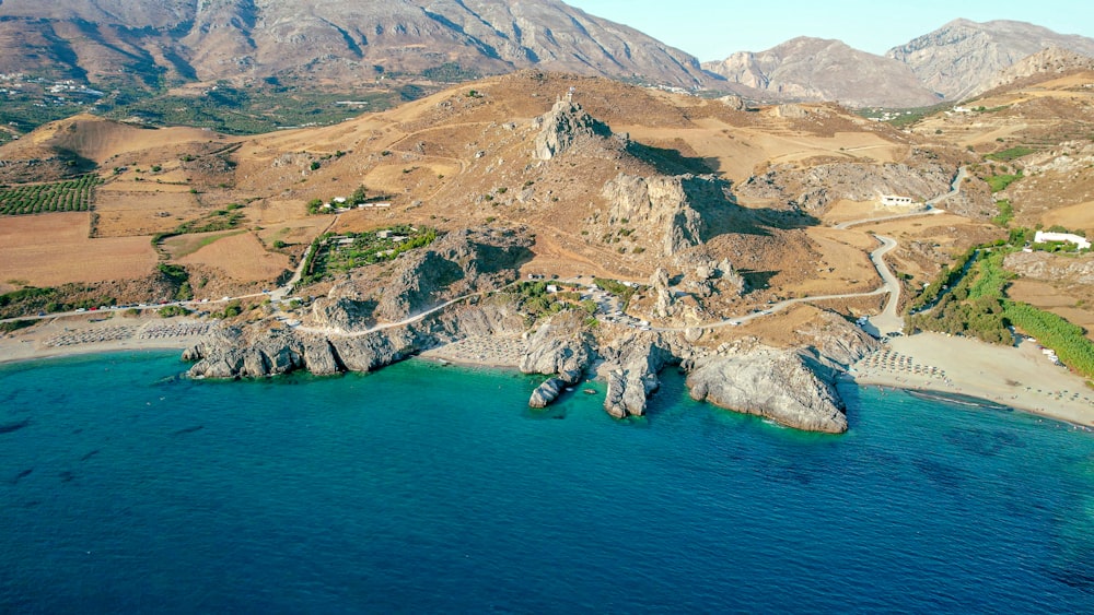 a bird's eye view of a beach and mountains