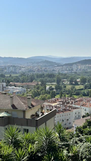 A panoramic view of Heragon City showing the elegant Mediterranean-style architecture and lush greenery.