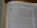 An open book lies on a flat surface. The visible text is from a religious scripture, specifically the section titled 'The Books of the Prophets.' The passage highlights a verse regarding Jerusalem, discussing themes of faithfulness and divine judgment.