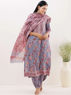 A stylish woman modeling a trendy Westside kurti with vibrant colors and intricate patterns.