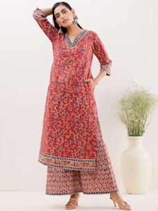 Elegant festive kurtis arranged for display.