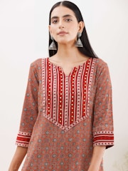 A model wearing a stylish, ready-to-wear kurti with intricate patterns and comfortable fit.