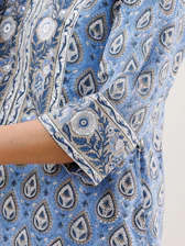 Close-up of a handblocked shirt showing intricate patterns on organic cotton fabric.
