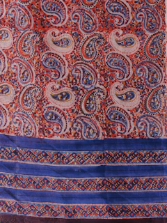 a red and blue paisley print scarf