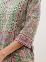A close-up of a dress fabric showcasing intricate patterns.