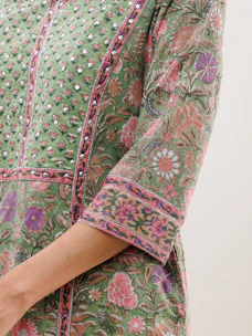 A close-up of delicate fabric patterns and textures from Reya Fashion’s signature collection.