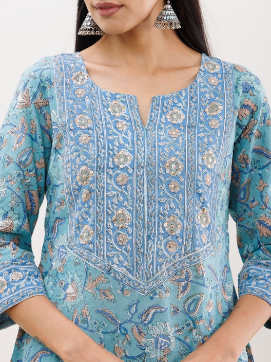 Close-up of colorful kurtis featuring intricate embroidery inspired by Bengal’s artistic heritage.
