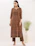 Close-up of a beige block print kurta with intricate floral patterns and soft pastel hues.
