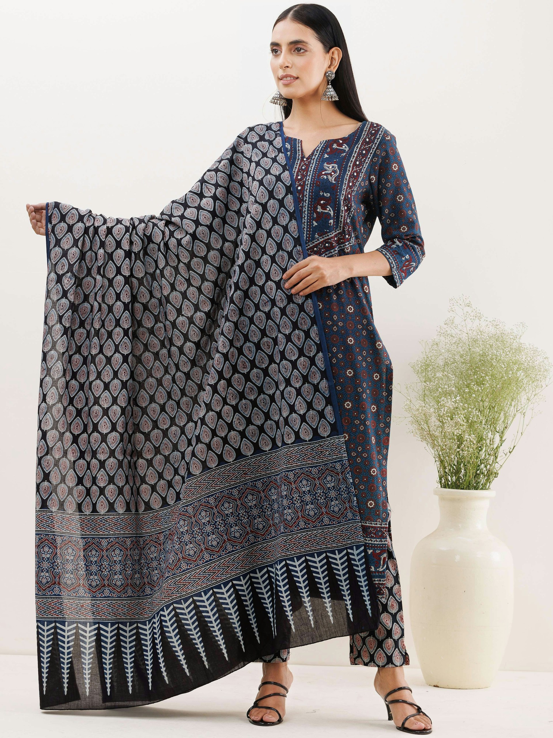 woman wearing yellow long-sleeved dress under white clouds and blue sky during daytime