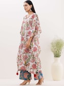 A vibrant outfit featuring a floral dress and sandals.