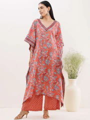 A fresh new arrival ensemble with modern cuts and soft fabric in muted orange and white hues.