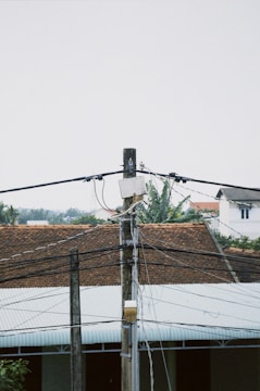 a telephone pole with a street light on top of it
