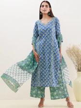 Close-up of a model wearing a chic short kurti paired with a coordinated set, smiling warmly in natural light.