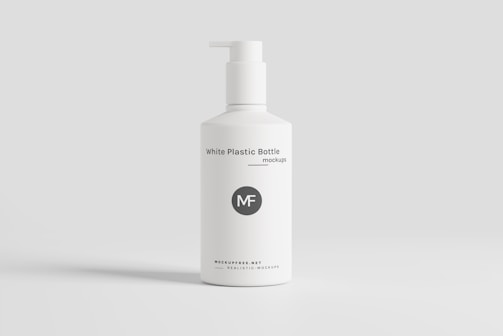 Close-up of a sleek Mist Pro 500 ml bottle with clear liquid soap and teal label on a clean white background.