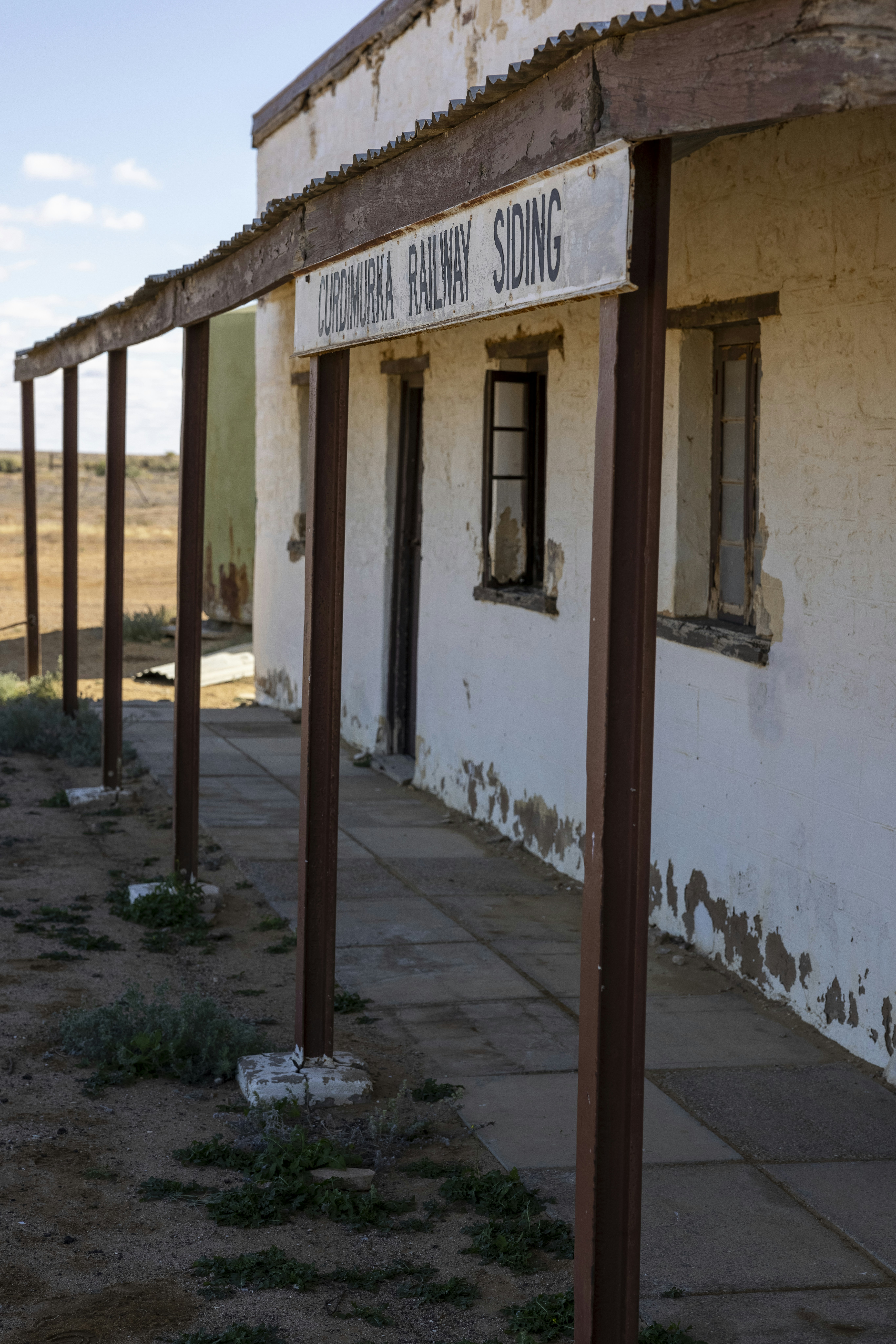 an old building with a sign on it