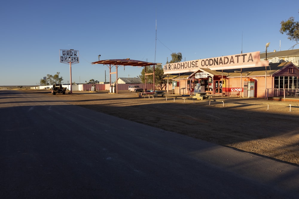 a small town with a gas station in the background