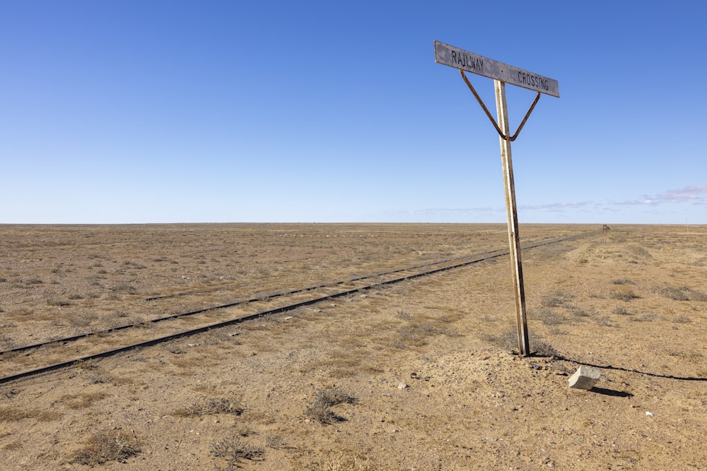 a street sign in the middle of a desert