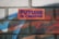 A brick wall features graffiti-style text that reads 'FUTURE IS CREATIVE' in bold purple letters against an orange background. Surrounding the text are vibrant spray-painted patterns in shades of blue, red, and white, providing a colorful and artistic backdrop.