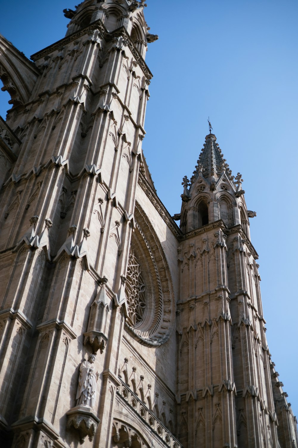 a very tall cathedral with a clock on it's side