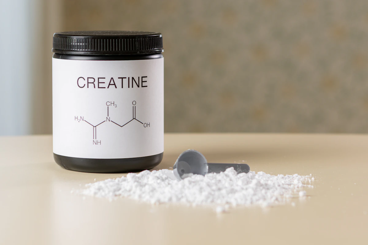 Creatine supplement bottle and scoop