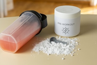 a close up of a container of powder and a spoon